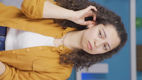 Vertical-video-of-Young-woman-with-itchy-ears.